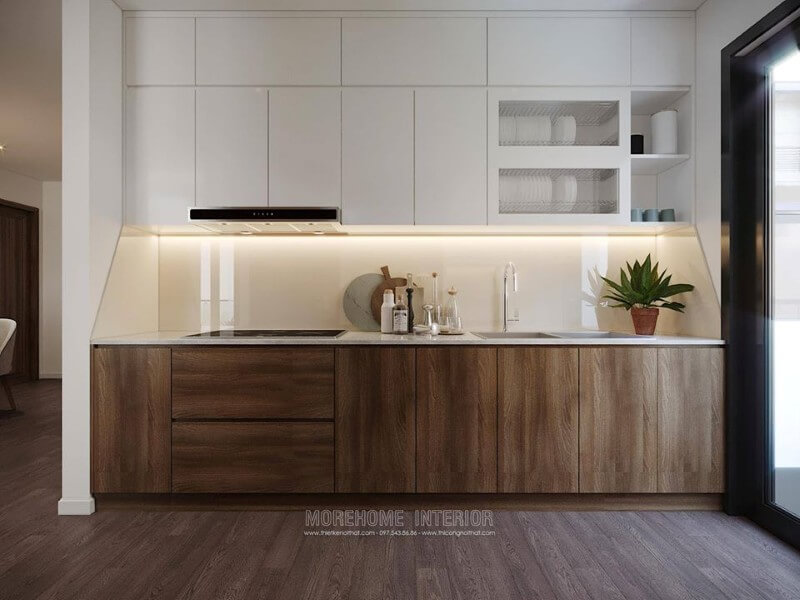 Tủ bếp dưới được làm từ gỗ công nghiệp, màu nâu trầm sang trọng, ngăn tủ cỡ lớn tạo sự thuận tiện cho việc cất, chứa đồ đạc của người nội trợ. Thiết kế phòng bếp đẹp và sang trọng